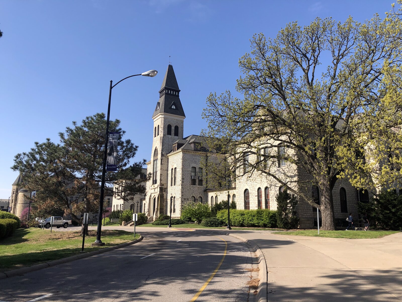 Campus road with Anderson Hall in the background
