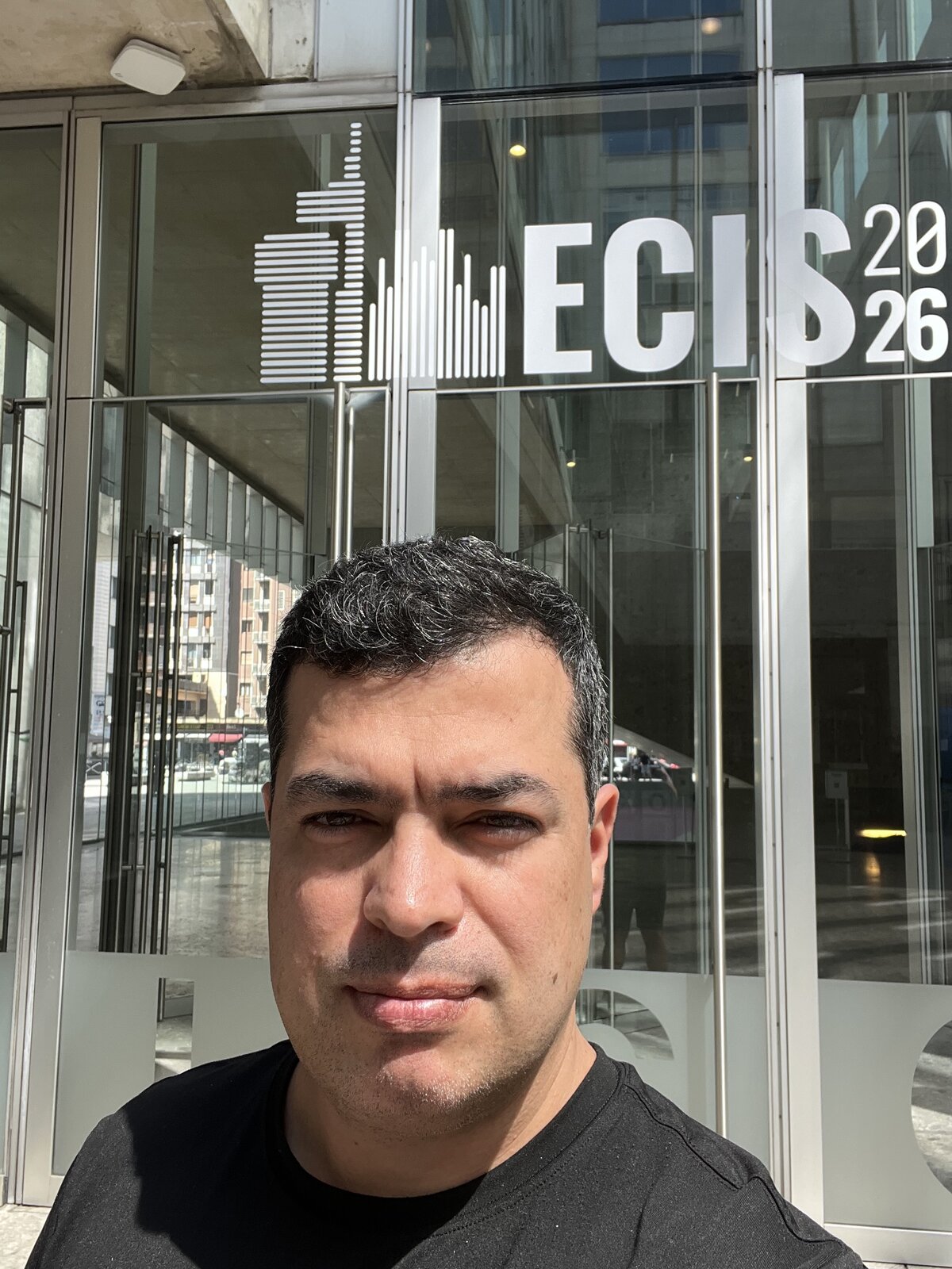 In front of the ECIS 2026 sign